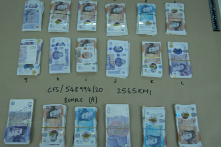 0007.24 Cash seized in the operation.jpg