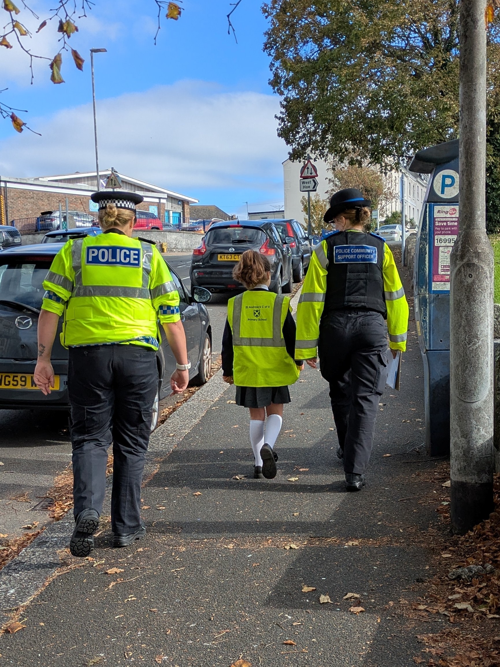Officers and child on patrol.jpg