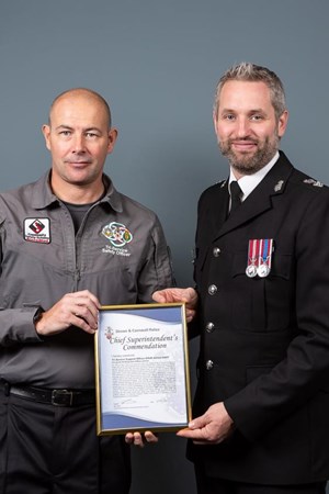 Tri Service Support Officer Adrian Hart receives his Chief Superintendent’s Commendation from Chief Superintendent Ben Deer, Commander for the Cornwall & Isles of Scilly police..jpg