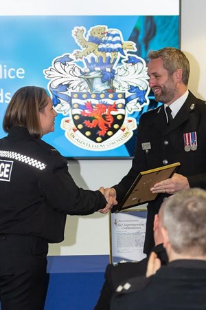 Chief Superintendent Ben Deer, Commander for the Cornwall & Isles of Scilly police at Devon & Cornwall Police hands out awards..jpg